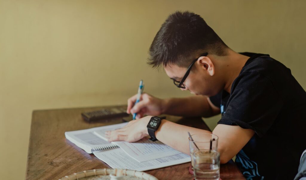 study habits for students at a clean desk with notes